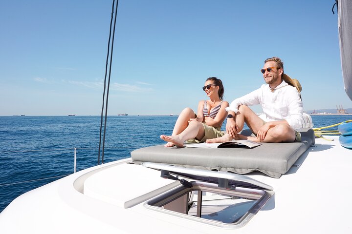 Aboard a catamaran, part of the Alella Winery ecological wine tour